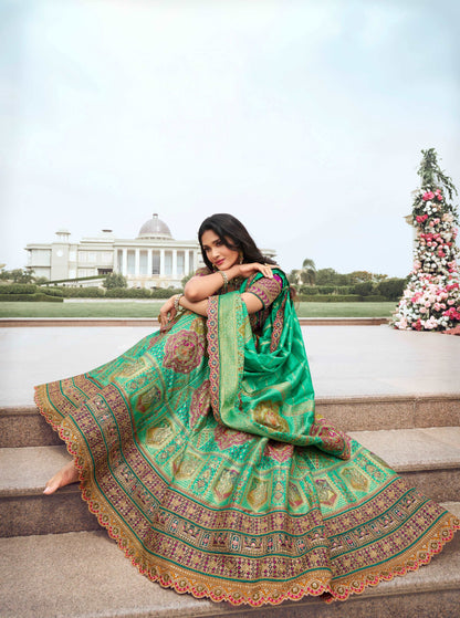 Green and Pink Banarasi Silk Lehenga with Zarkan Codding Work - Femenica